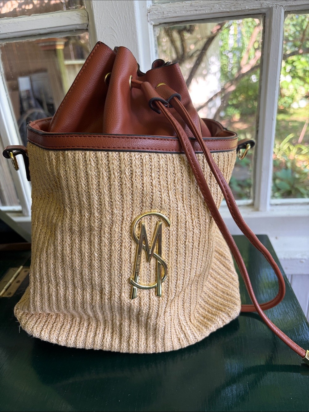 Steve Madden, Straw Bucket Bag with signature initial and Brown Leather Trim